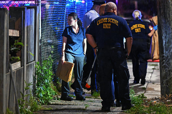 Police work at the scene of a shooting July 3, 2023 in Philadelphia, Pennsylvania.  Initial reports indicate the suspect is in custody after shooting 8 people in the Kingsessing neighborhood of Philadelphia on July 3.  (Drew Hallowell/Getty Images)