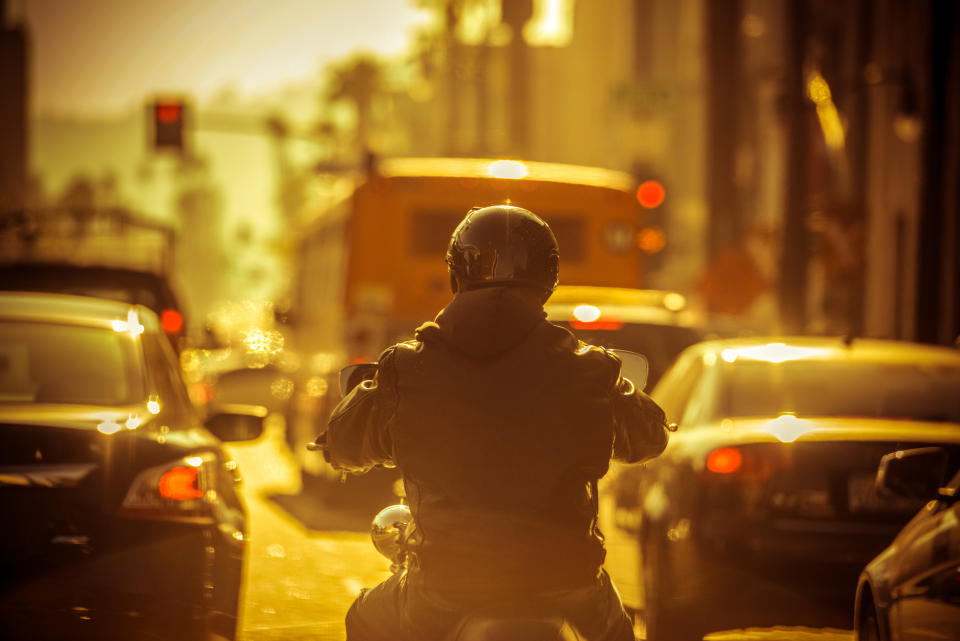 A motorcycle weaving through traffic