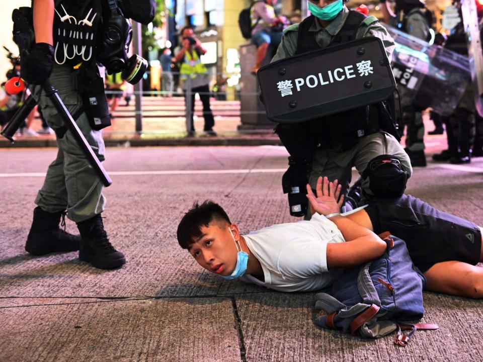 Police officers detain protesters during a rally against a new national security law on the 23rd anniversary of the establishment of the Hong Kong Special Administrative Region in Hong Kong, China, 1 July 2020: Miguel Candela/EPA