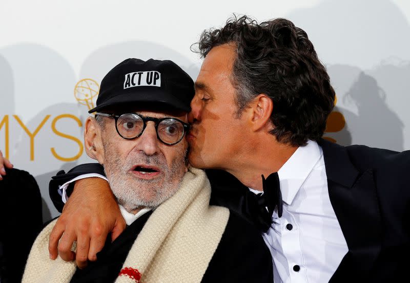 FILE PHOTO: Larry Kramer and Mark Ruffalo pose backstage after winning the Outstanding Television Movie award for HBO's "The Normal Heart" at the 66th Primetime Emmy Awards in Los Angeles