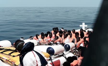 Migrants are seen after being rescued by MV Aquarius, a search and rescue ship run in partnership between SOS Mediterranee and Medecins Sans Frontieres in the central Mediterranean Sea, June 12, 2018. Karpov / SOS Mediterranee/handout via REUTERS