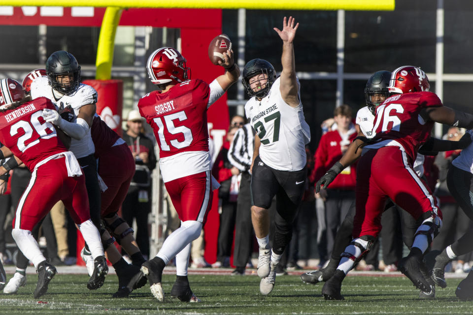 Michigan State linebacker Cal Haladay (27) pressures Indiana quarterback Brendan Sorsby (15) as he makes a pass during the second half of an NCAA college football game, Saturday, Nov. 18, 2023, in Bloomington, Ind. (AP Photo/Doug McSchooler)