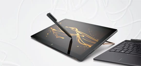 A pen hovers over the screen of HP's Spectre x2.