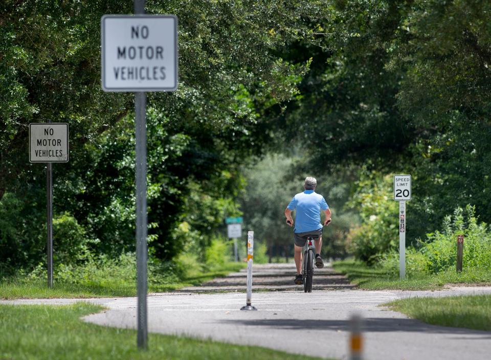 A cyclist rides along the Blackwater Heritage State Trail in Milton on Tuesday. The Florida-Alabama Transportation Planning Organization is working on its newest round of multi-year project priorities, and walkability and bikeability is high on the to-do list in Santa Rosa County.
