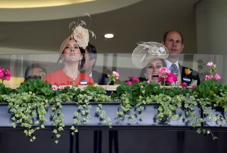 Catherine, Duchess of Cambridge, Mary, Crown Princess of Denmark (L) and Prince Edward (R) watch a race. Reuters / Toby MelvilleLivepic