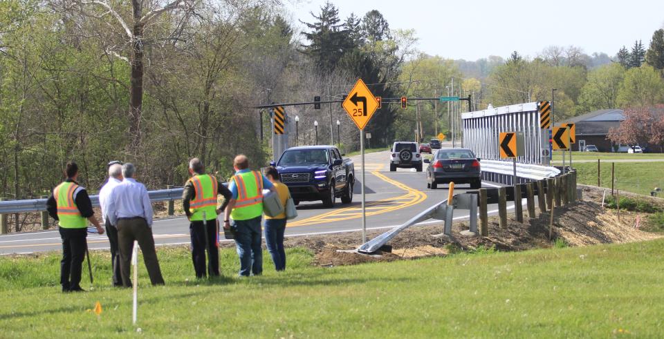 Newark city officials celebrate the reopening April 27 of Cherry Valley Road with a "Liberty Bridge" that spans over top of the deteriorating old Showman Arch Bridge, which had been closed since early October due to deteriorating conditions.