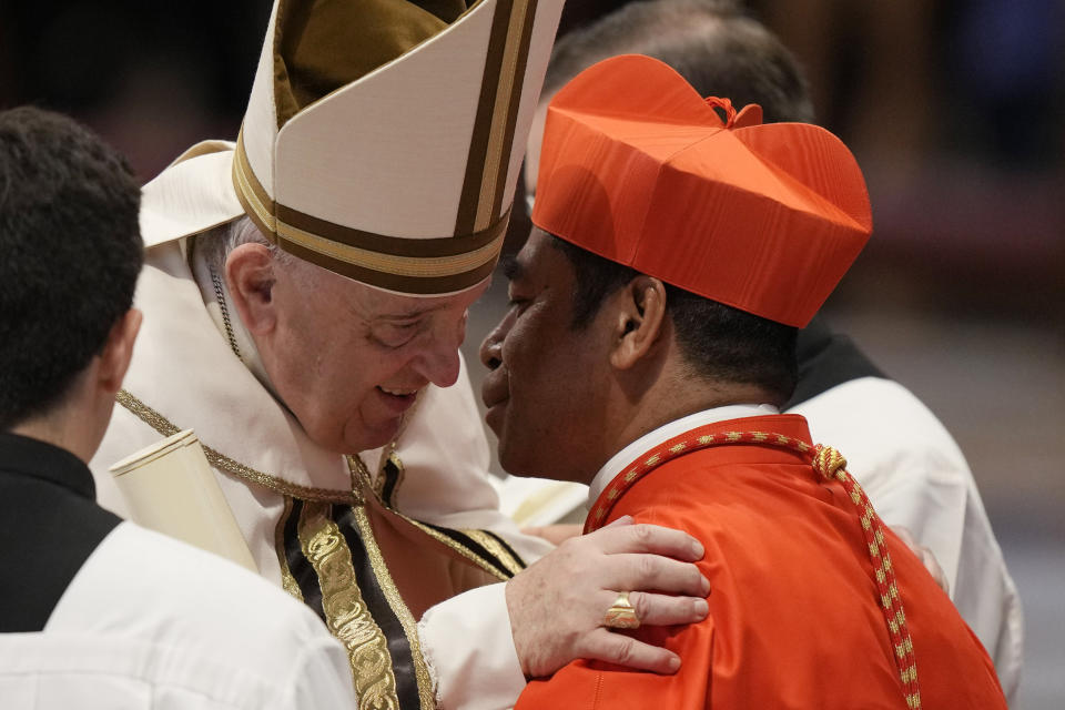 New Cardinal Virgilio Do Carmo Da Silva receives the red three-cornered biretta hat from Pope Francis during a consistory inside St. Peter's Basilica, at the Vatican, Saturday, Aug. 27, 2022. Pope Francis has chosen 20 men to become the Catholic Church's newest cardinals. (AP Photo/Andrew Medichini)