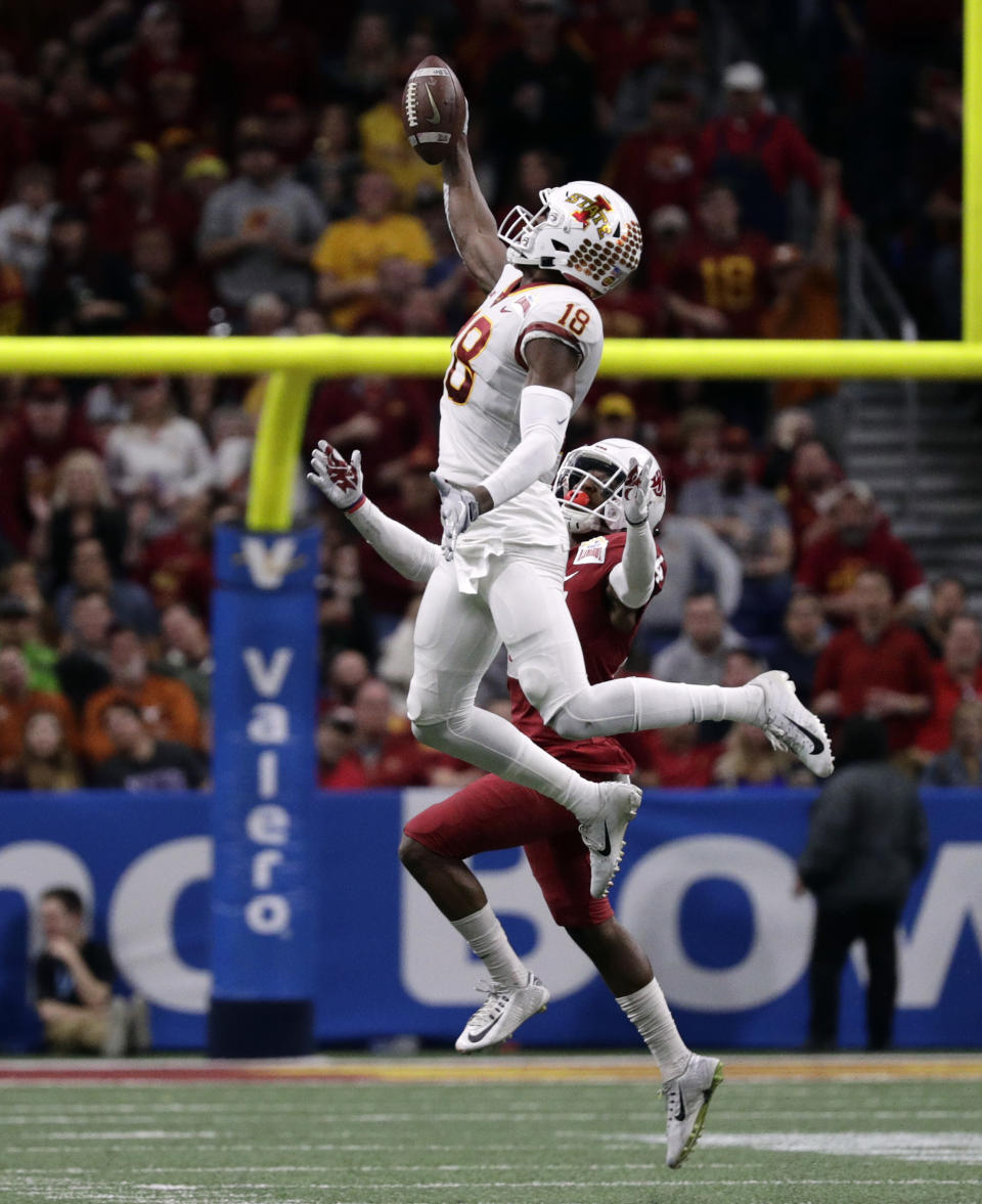 Iowa State wide receiver Hakeem Butler (18) makes a catch over Washington State safety Jalen Thompson during the second half of the Alamo Bowl NCAA college football game, Friday, Dec. 28, 2018, in San Antonio. (AP Photo/Eric Gay)