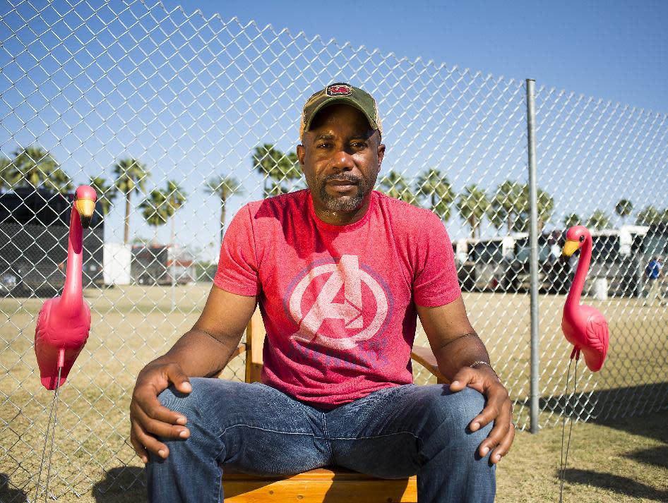 FILE - In this April 28, 2013 file photo, singer Darius Rucker poses for a portrait backstage on day 3 of the 2013 Stagecoach Music Festival at the Empire Polo Club, in Indio, Calif. Rucker's version of "Wagon Wheel" is the most successful song of his country career. The cut from his third Nashville-recorded album, "True Believers," out on May 21, 2013, has sold nearly 1.2 million copies and sat atop the country charts for three consecutive weeks early this year. (Photo by Dan Steinberg/Invision/AP, File)