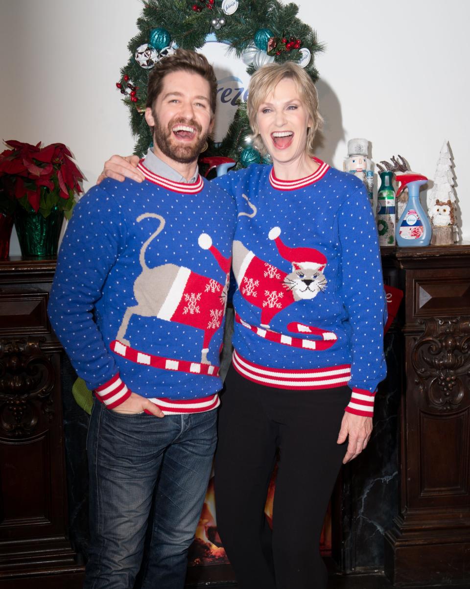 Matthew Morrison and Jane Lynch wear matching festive sweaters