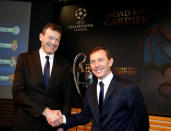 Andreas Jung (L), Executive Board Member of Bayern Munich, shakes hand with Real Madrid's director Emilio Butragueno after the draw of the UEFA Champions League quarterfinals in Nyon, Switzerland March 17, 2017. REUTERS/Denis Balibouse