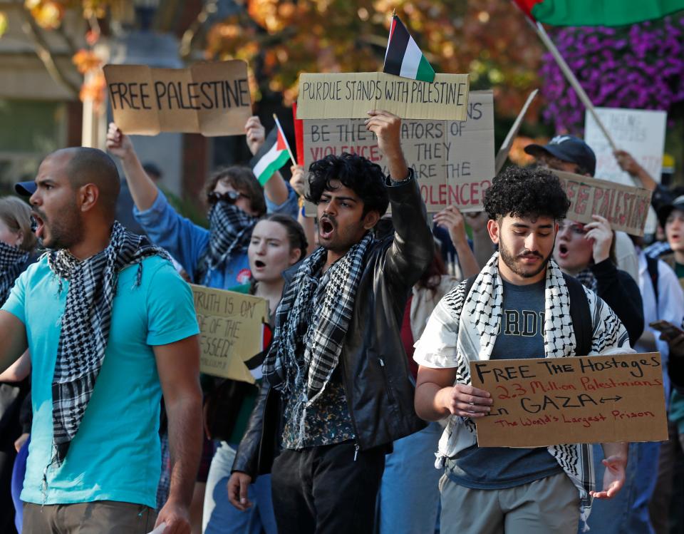 Demonstrators march on campus in response to the Palestine and Israel conflict, Thursday, Oct. 12, 2023, at Purdue University in West Lafayette, Ind.