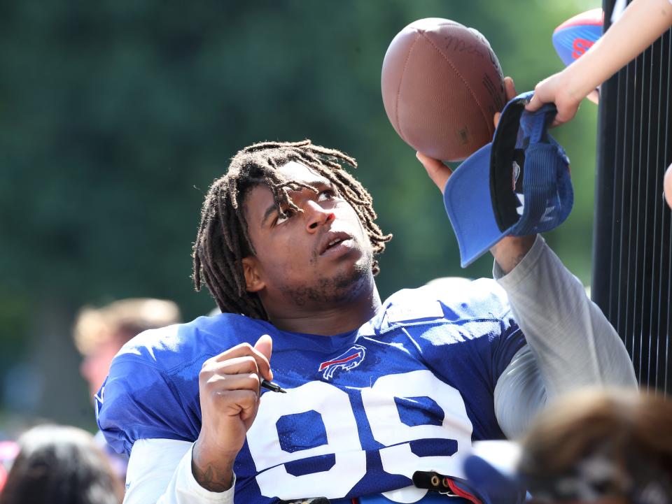 Bills defensive lineman Tim Settle signs autographs for fans on the last day of the Buffalo Bills training camp at St John Fisher University in Rochester Thursday, Aug. 11, 2022. 