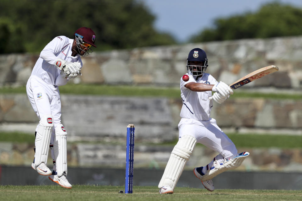 India's Ajinkya Rahane plays a shot against West Indies during day one of the first Test cricket match at the Sir Vivian Richards cricket ground in North Sound, Antigua and Barbuda, Thursday, Aug. 22, 2019. (AP Photo/Ricardo Mazalan)