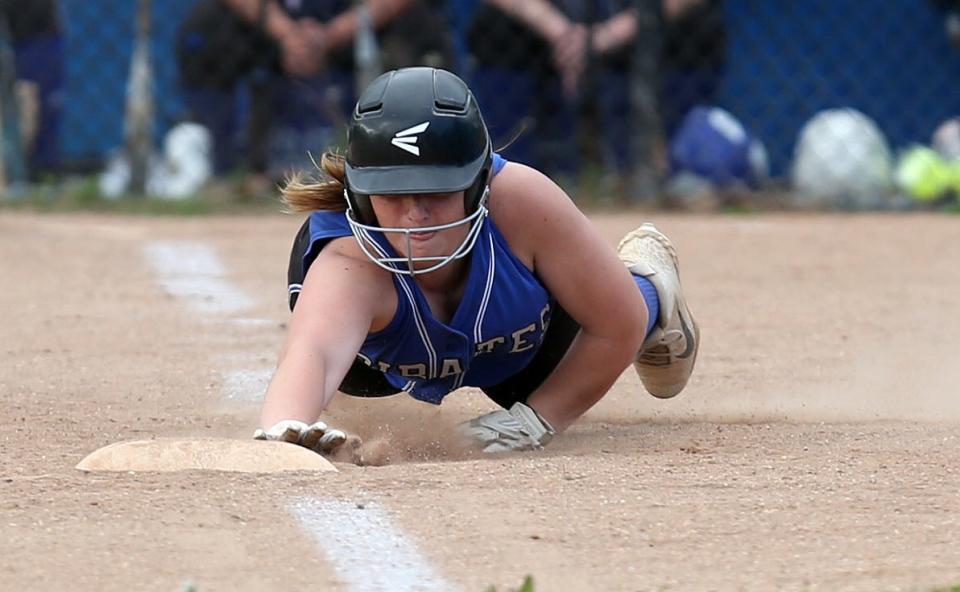 Pearl River's Grace Scrima (9) dives back to third safely after over running the bag against Nanuet in softball action at Pearl River High School  May 11, 2022. Pearl River won the game 15-0.