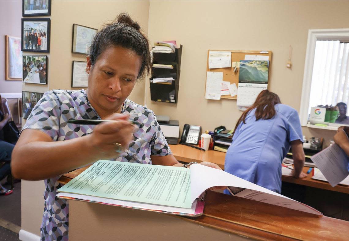 Leda Lanza, left, owner of the East Cypress Women’s Center, files paperwork during a busy morning at the abortion clinic on Monday, April 24, 2023.