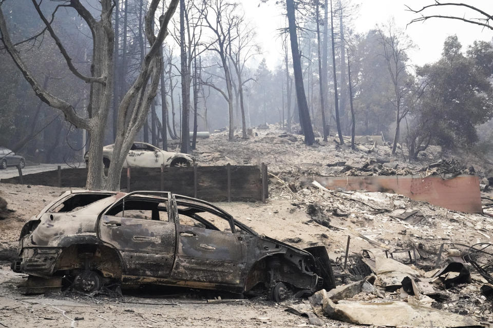 Burned vehicles and homes have been reduced to rubble after the CZU Lightning Complex Fire went through Sunday, Aug. 23, 2020, in Boulder Creek, Calif. (AP Photo/Marcio Jose Sanchez)