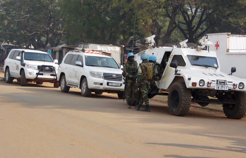 U.N. peacekeepers take a break as they patrol along a street during the presidential election in Bangui, the capital of Central African Republic, December 30, 2015.