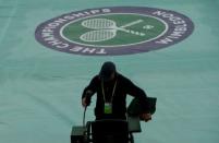 Britain Tennis - Wimbledon - All England Lawn Tennis & Croquet Club, Wimbledon, England - 1/7/16 General view during a rain delay REUTERS/Tony O'Brien