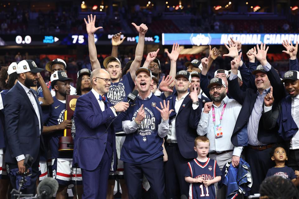 Head coach Dan Hurley of the Connecticut Huskies celebrates with his team during the trophy ceremony on April 08, 2024 in Glendale, Arizona.