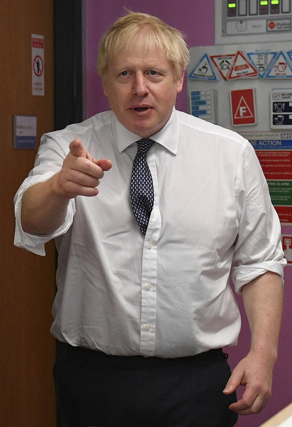 Britain's Prime Minister Boris Johnson gestures as he talks to nursing staff at King's Mill Hospital in Mansfield, northern England, Friday Nov. 8, 2019, during a general election campaign visit. Britain goes to the polls on Dec. 12 to vote in a pre-Christmas general election. (Daniel Leal-Olivas/Pool via AP)