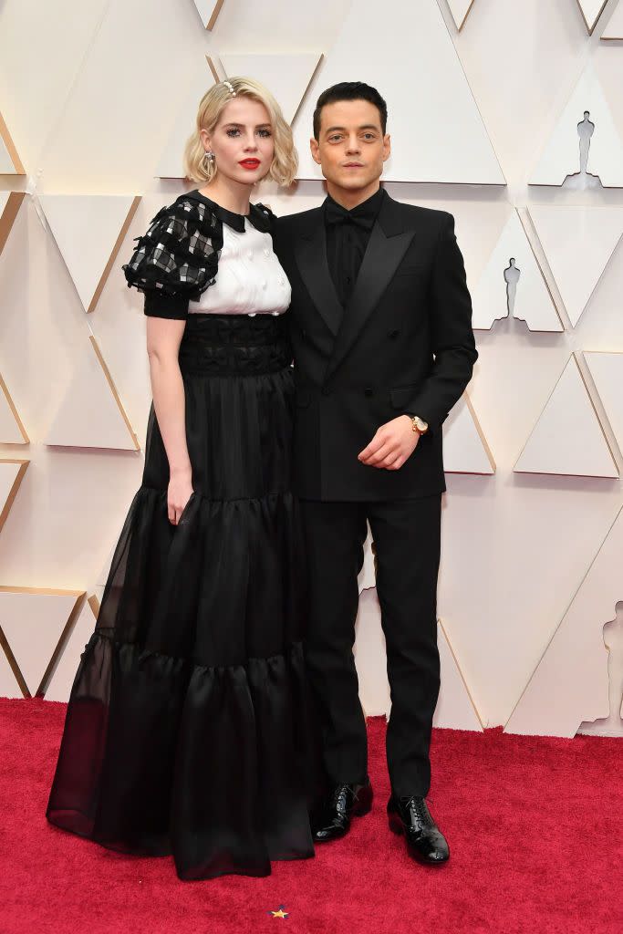 <p>A year after Malek triumphed at the Oscars for Bohemian Rhapsody, the couple attended again with Boynton wearing a Chanel monochrome puff sleeve dress.</p>