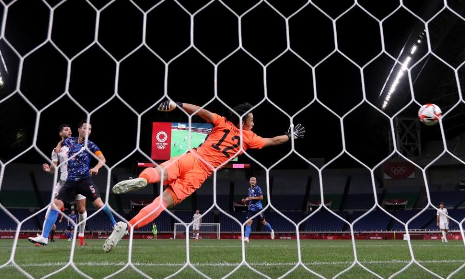 Kosei Tani watches Asensio’s shot go past him for the only goal of the game.