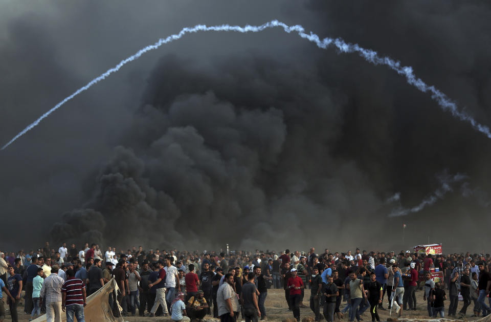 Palestinians protest at the Gaza Strip's border with Israel, Friday, Oct. 5, 2018. (AP Photo/Khalil Hamra)