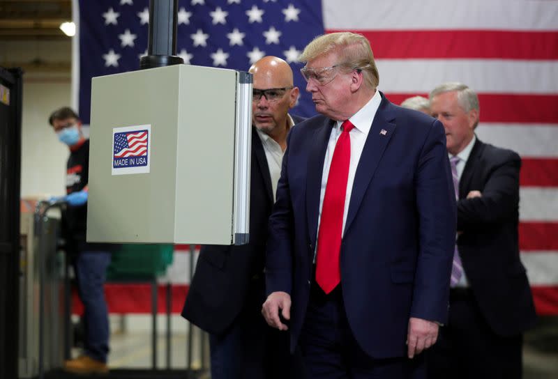 FILE PHOTO: U.S. President Donald Trump tours face mask production facility in Phoenix, Arizona