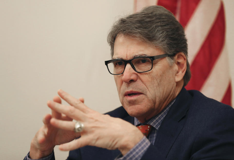 The outgoing U.S. Energy Secretary Rick Perry talks to the journalists during a roundtable presser in Dubai, United Arab Emirates, Saturday, Oct. 26, 2019. (AP Photo/Kamran Jebreili)