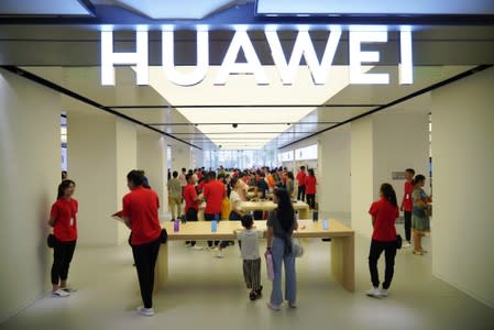 People visit a newly opened Huawei store in Xian