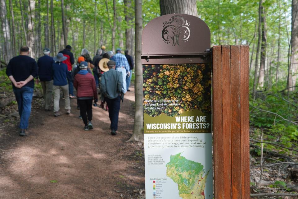 A bird watching group walks on a trail May 12 at the Forest Exploration Center, a state-owned property in Wauwatosa.