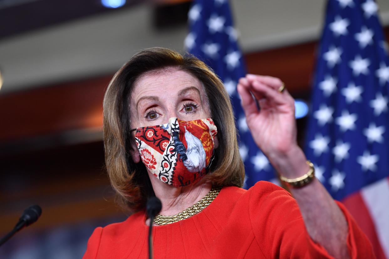 Speaker of the House Nancy Pelosi (D-Caif.) speaks during her weekly press briefing at Capitol Hill on Friday. She said "there is momentum&rdquo; for passing a coronavirus relief bill.  (Photo: NICHOLAS KAMM via Getty Images)