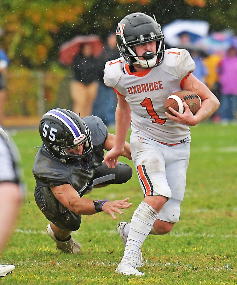 Uxbridge's Liam Kaferlein gets past the diving tackle attempt of Valley Tech's Aiden Bailer.