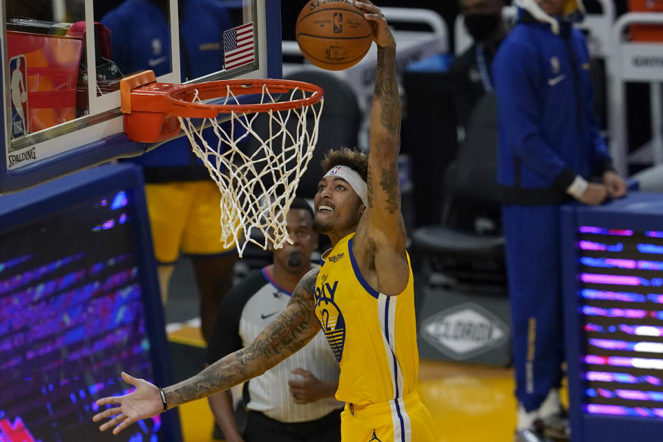 Golden State Warriors forward Kelly Oubre Jr. dunks against the Sacramento Kings during the first half of an NBA basketball game in San Francisco, Monday, Jan. 4, 2021. (AP Photo/Jeff Chiu)