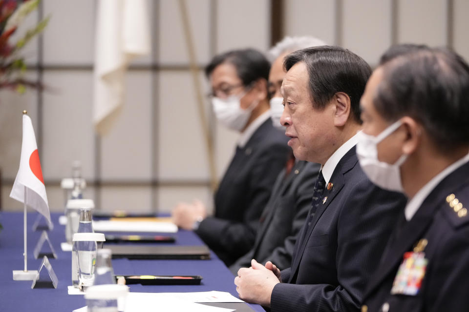 Japan's Defense Minister Yasukazu Hamada, center, speaks during a talk with Australia's Defence Minister Richard Marles at the Iikura guesthouse in Tokyo, Friday, Dec. 9, 2022. (AP Photo/Hiro Komae, Pool)