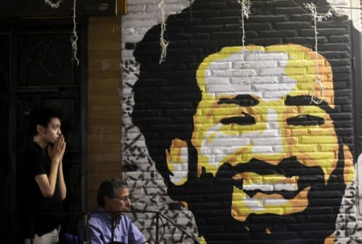 A man reacts as he watches the the UEFA Champions League final football match, between Real Madrid and Liverpool, at a coffee shop in the Egyptian capital Cairo on May 26, 2018