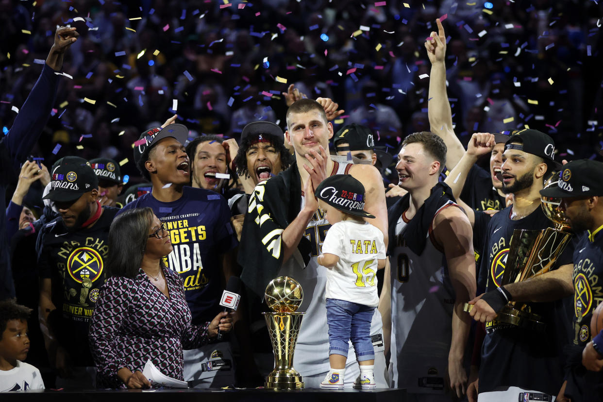 The defending champion Nuggets tip things off tonight in Denver. (Matthew Stockman/Getty Images)