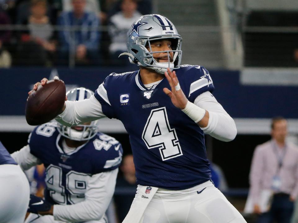 FILE - In this Dec. 15, 2019, file photo, Dallas Cowboys quarterback Dak Prescott (4) looks to throw in the first quarter of an NFL football game against the Los Angeles Rams in Arlington, Texas. Dallas quarterback Dak Prescott and NFL rushing leader Derrick Henry of Tennessee will play whatever becomes of the 2020 season under the one-year franchise tag after failing to reach long-term deals with their teams. Prescott is set to make $31.4 million after earning slightly more than $4 million under his four-year rookie contract. The 2016 NFL Offensive Rookie of the Year negotiated for more than a year without coming to terms on a deal. (AP Photo/Michael Ainsworth, File)