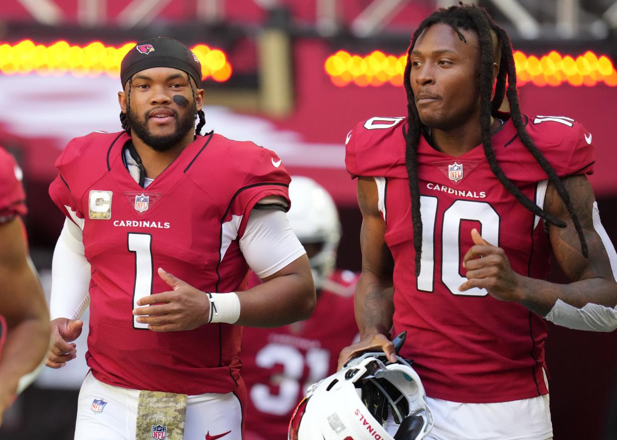 Nov 6, 2022; Phoenix, AZ, United States; Arizona Cardinals quarterback Kyler Murray (1) and DeAndre Hopkins (10) take the field against the Seattle Seahawks at State Farm Stadium.