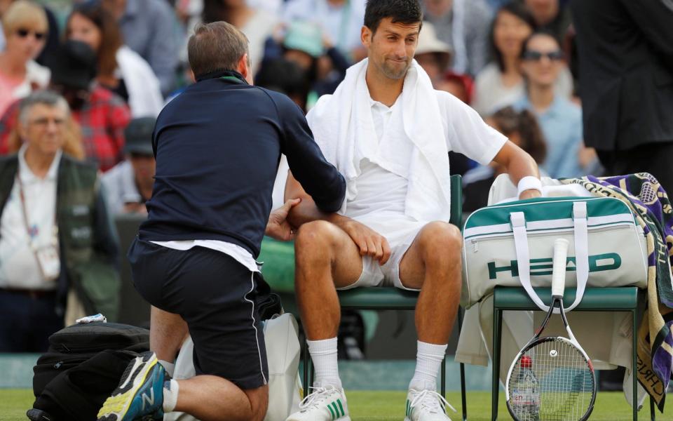 Injured Novak Djokovic
