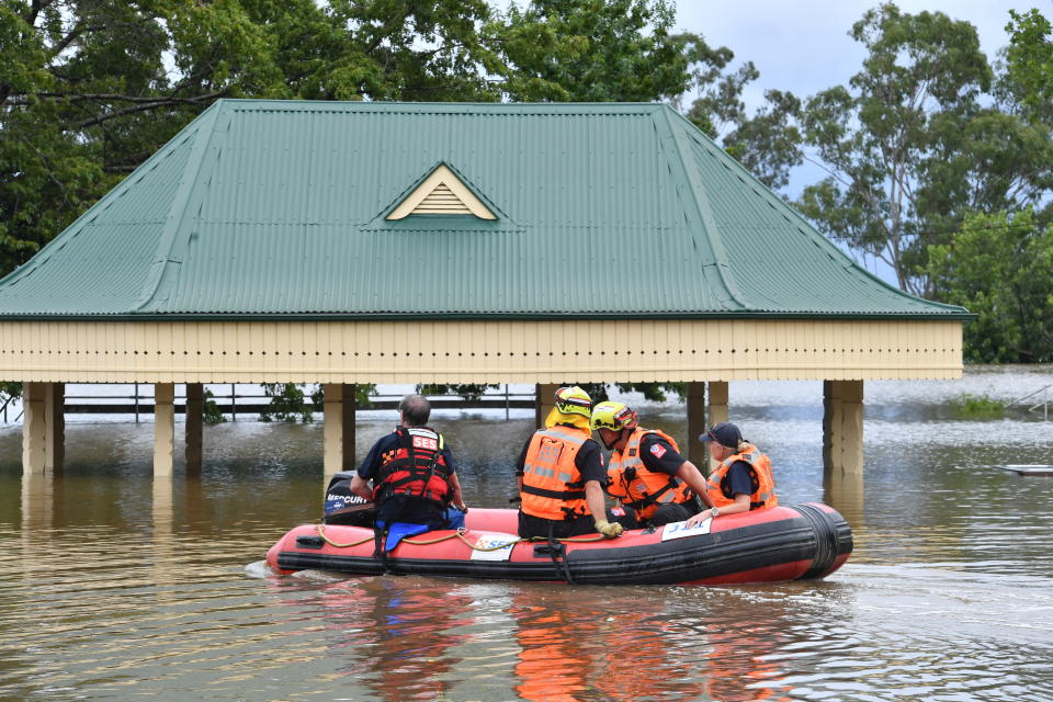 SES volunteers launch an inflatable rescue boat in Camden, South Western Sydney, Tuesday, March 8, 2022. 