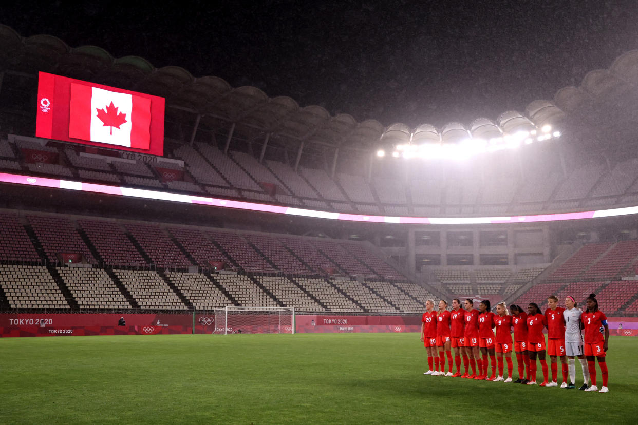 The Canadian women's soccer team stands for the natoinal anthem before a match in the 2020 Olympics. (Atsushi Tomura/Getty Images)