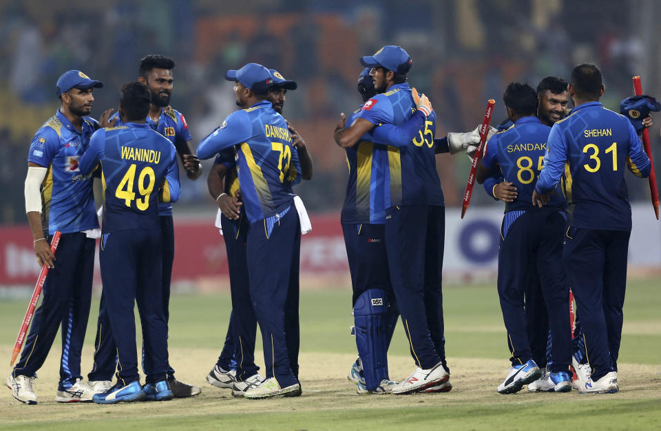 Sri Lankan players congratulate each other after the winning the first Twenty20 match against Pakistan at Gaddafi stadium in Lahore, Pakistan, Saturday, Oct. 5, 2019. (AP Photo/K.M. Chaudary)