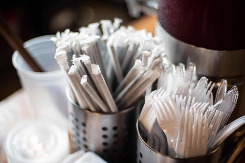 Plastic straws wrapped in paper and plastic forks are seen at a food hall in Washington DC on June 20, 2019. - "How do you drink a milkshake without a straw?" The city of Washington has decided, in the name of the environment, to ban plastic drinking straws — an act viewed as almost sacrilegious in the birthplace of this simple but seemingly indispensable part of daily American life.In the last century, millions of straws were produced in the Stone Straw Building, a stolid-looking structure of yellowing brick in a residential neighborhood. The building now houses the capital's transit police headquarters. The only visible sign of its historic character comes from a discreet commemorative plaque affixed to a wall above a garbage bin that honors the memory of Marvin C. Stone, "Inventor of the Paper Straw." (Photo by Eric BARADAT / AFP)ERIC BARADAT/AFP/Getty Images ** OUTS - ELSENT, FPG, CM - OUTS * NM, PH, VA if sourced by CT, LA or MoD **