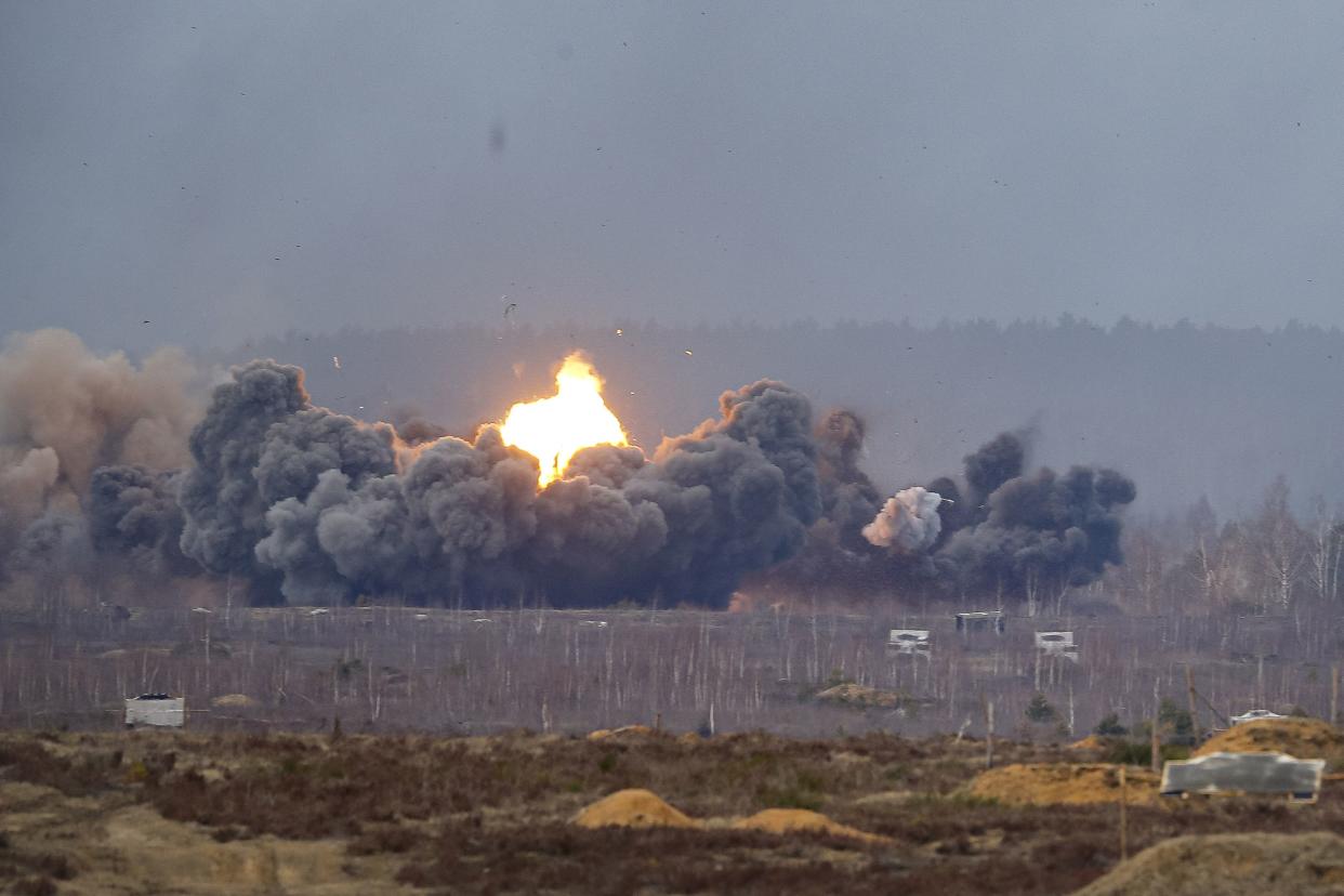 Smoke and flames rise over a field during the Union Courage-2022 Russia-Belarus military drills at the Obuz-Lesnovsky training ground in Belarus, Saturday, Feb. 19, 2022. Russia has deployed troops to its ally Belarus for sweeping joint military drills that run through Sunday, fueling Western concerns that Moscow could use the exercise to attack Ukraine from the north.