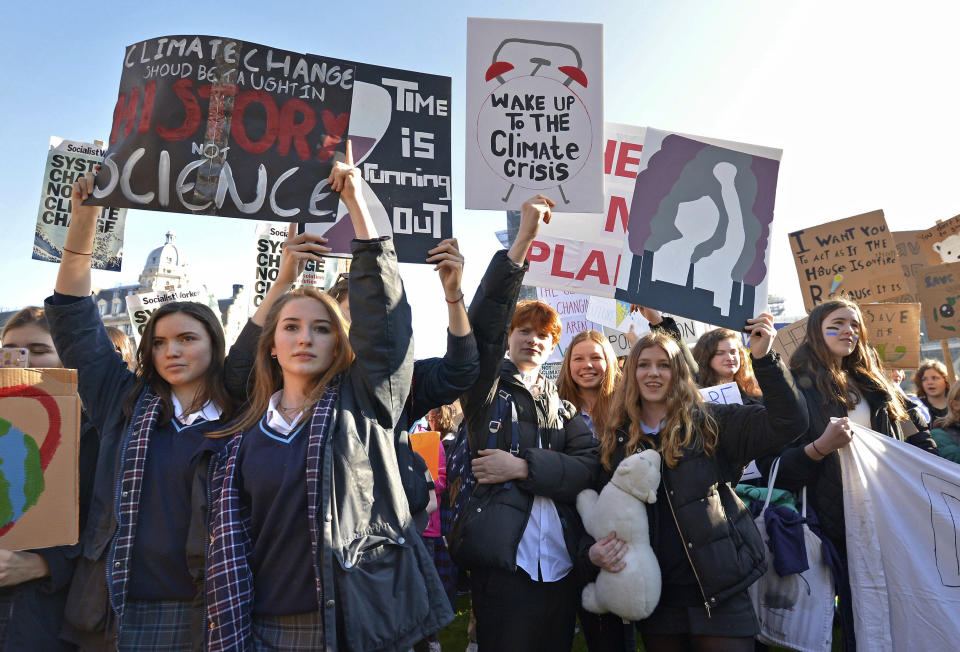 Students join the Youth Strike 4 Climate movement during a climate change protest near Parliament in London, Friday Feb. 15, 2019. The demonstration is one many nationwide to demand action against climate change. (Nick Ansell/PA via AP)