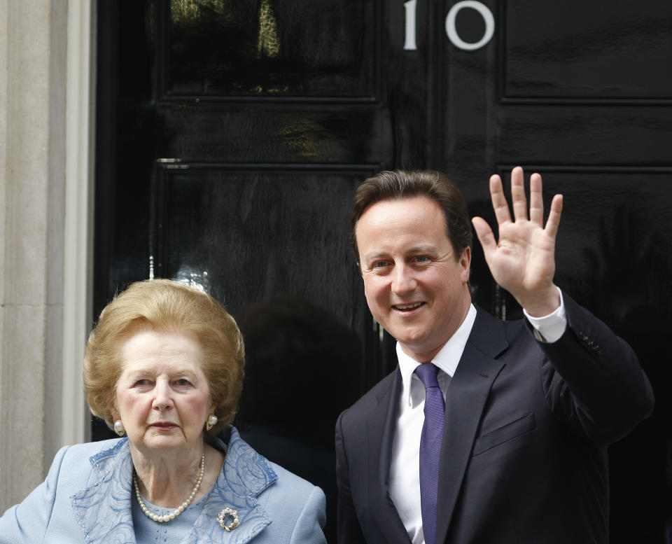 FILE- In this June, 8, 2010 file photo, Britain's Prime Minister David Cameron, right, poses with former Prime Minister Margaret Thatcher on the doorstep of 10 Downing Street in London. For the past three decades, many Britons had hoped the rigid class system that defined their country from Dickens to “Downton Abbey” was finally dying. Now they fear that class, their old bugbear, is back on the rise. (AP Photo/Alastair Grant, File)