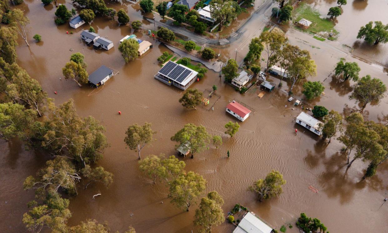 <span>Floods in Rochester, Australia, in January. </span><span>Photograph: Diego Fedele/Getty Images</span>