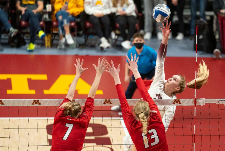 Minnesota's Jenna Wenaas (2) spikes the ball in the second set against  South Dakota in a first-round match of the NCAA women's volleyball tournament, Friday, Dec. 3, 2021, in Minneapolis.